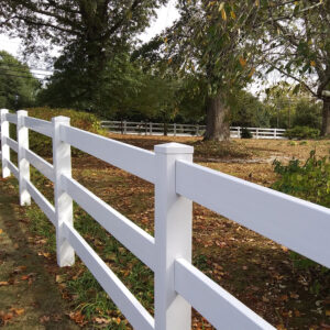 3 rail white vinyl horse fence in the fall