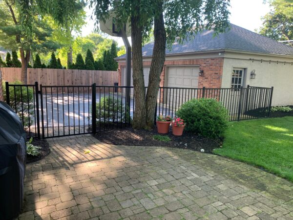 Durables Canfield Aluminum Fence on brick path