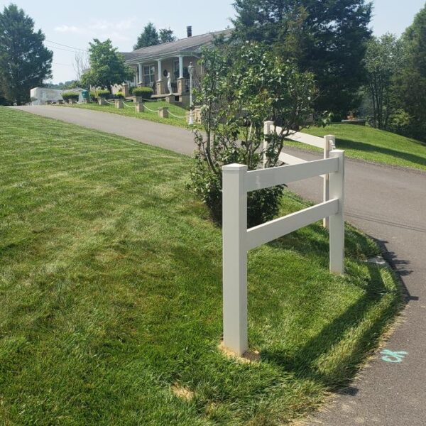 2 rail horse fence along road