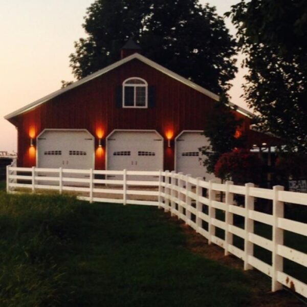 4 Rail Ranch Rail in front of garage barn