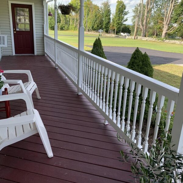 Ashington white vinyl railing on red porch