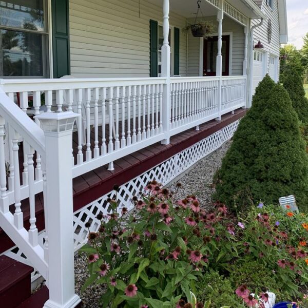 Ashington white vinyl railing on red porch alternate angle