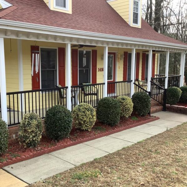 Dalton Aluminum Railing on Yellow House