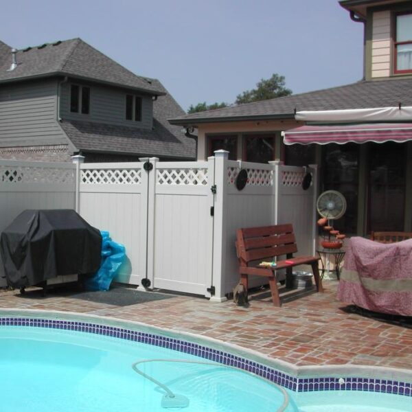 Canterbury white vinyl privacy fence gate near pool