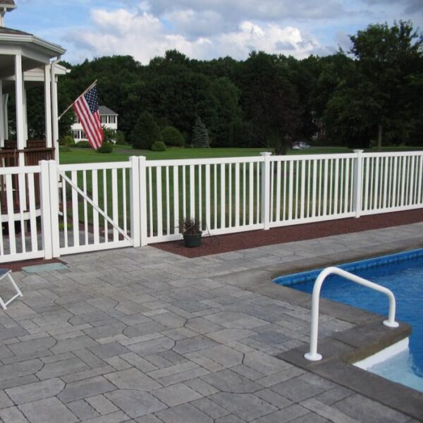 Cargill white vinyl pool fence with American flag