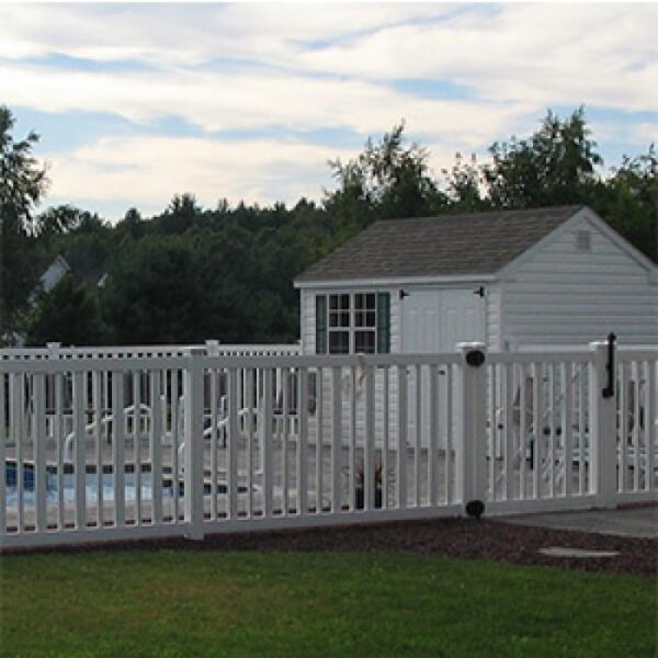 Cargill white pool fence in front of pool house