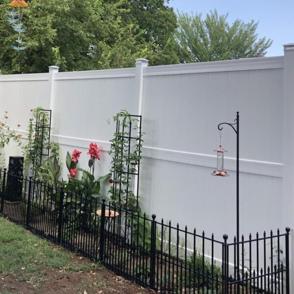 Newport white vinyl privacy fence with gated garden