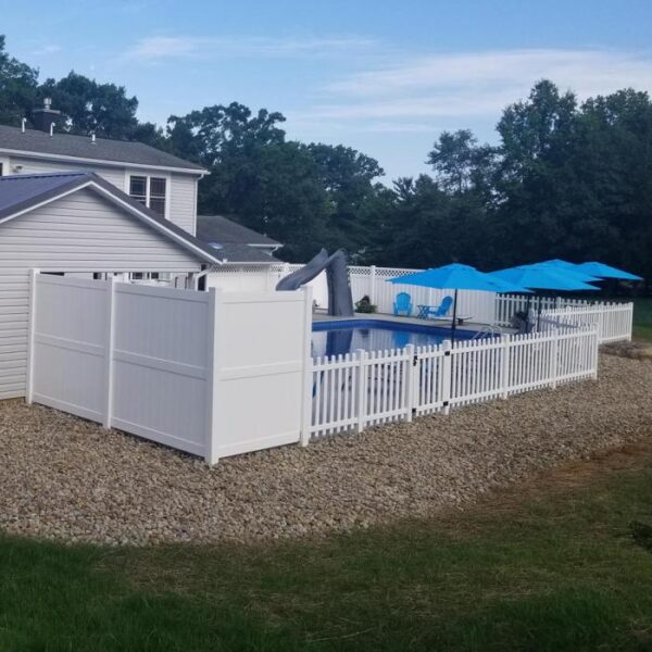 Newport white vinyl privacy fence with picket fencing