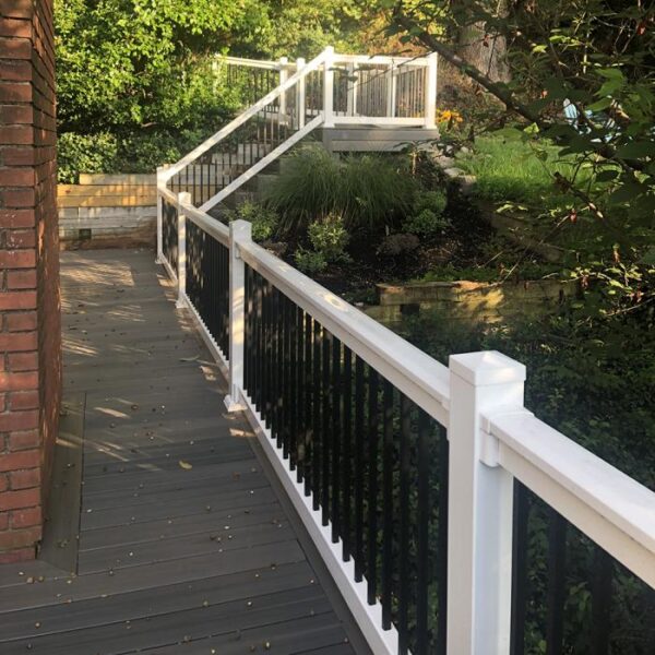 Bradford White vinyl railing forest deck