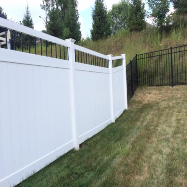 Townsend white vinyl privacy fence with aluminum fencing