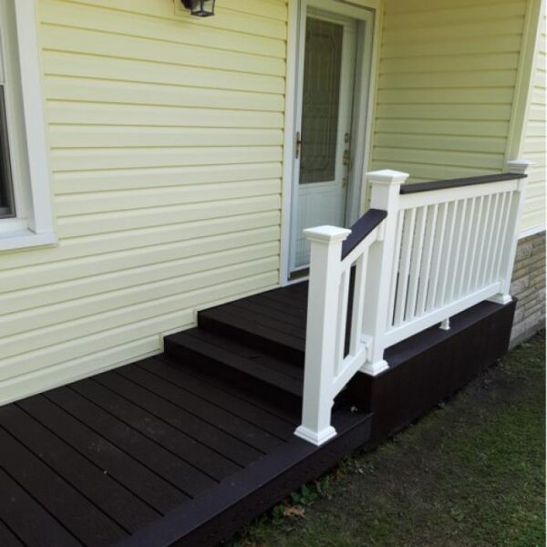 Bexley white vinyl railing on yellow house