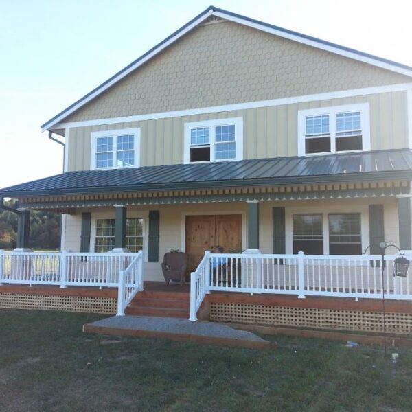 Westport white vinyl railing along long porch