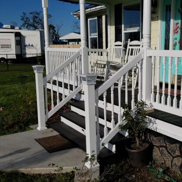 Westport white vinyl railing on black stairs