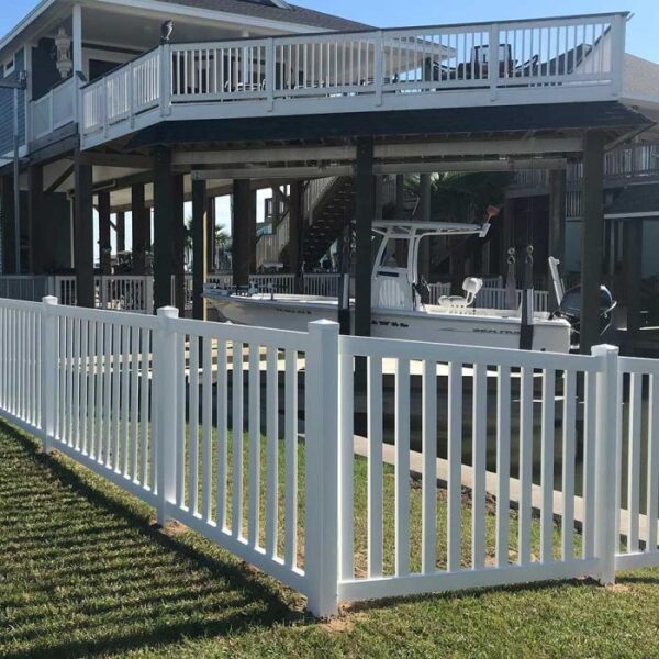 Waldston white vinyl pool fence with boat in background