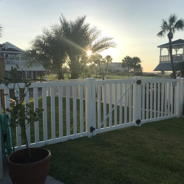 Waldston white vinyl pool fence gate in the sunset