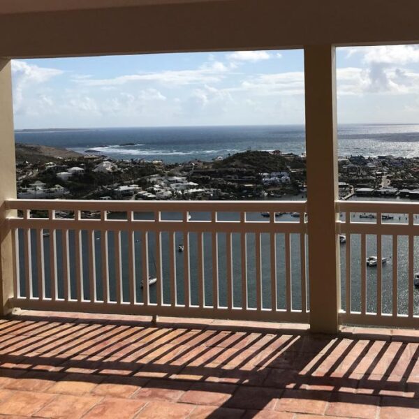 Dorset white vinyl railing in the shadows