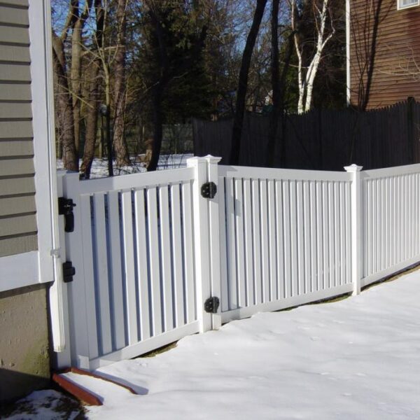 Stanton white vinyl pool fence gate in the snow