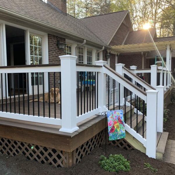 Warrington white vinyl railing with dog on porch