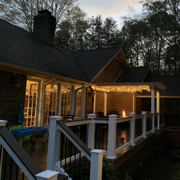 Warrington white vinyl railing on dark porch