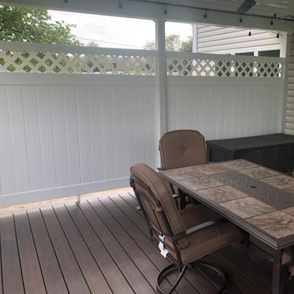 Winchester white vinyl privacy fence on deck with table