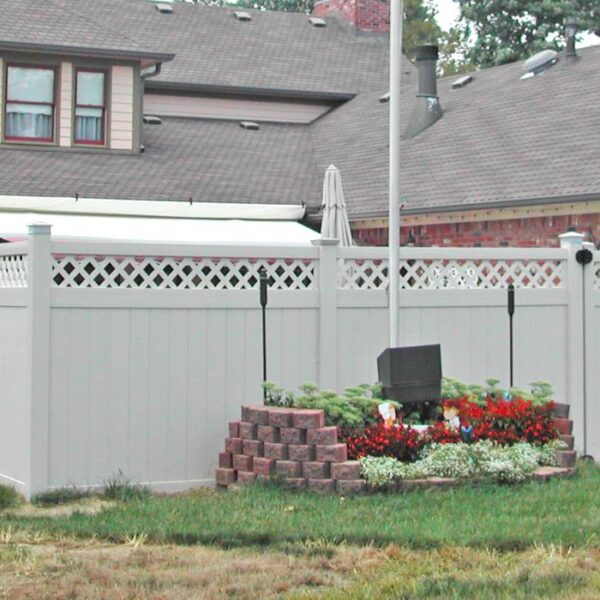 Winchester white vinyl privacy fence with flagpole