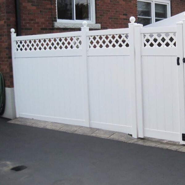 Winchester white vinyl privacy fence on driveway