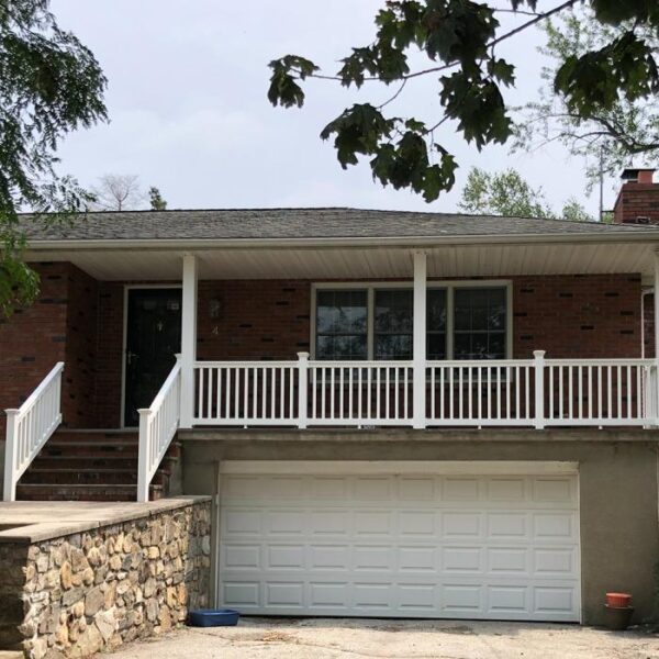 Waltham white vinyl railing over garage