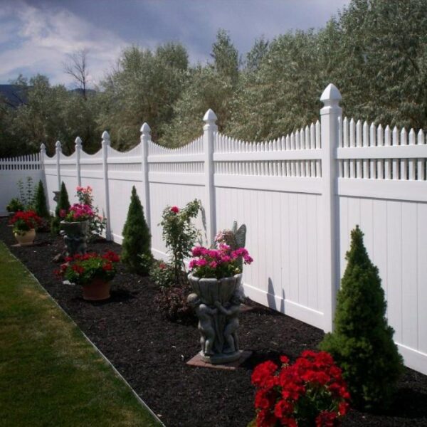 Turnbridge white vinyl privacy fence in flower garden alternate angle