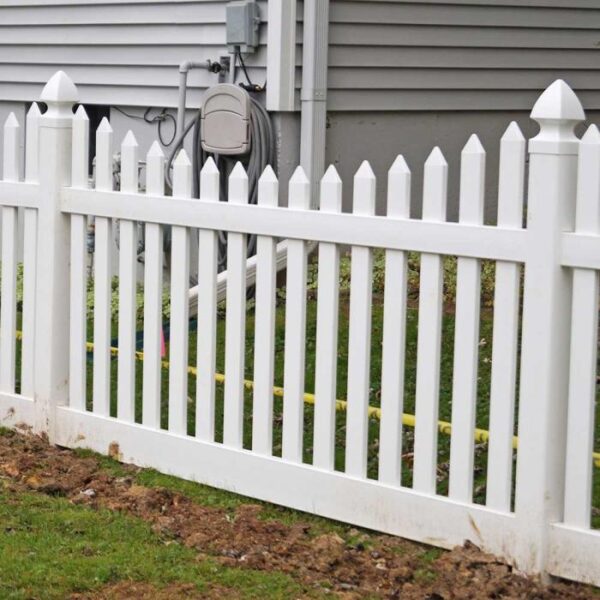 Grantham white vinyl picket fence close up