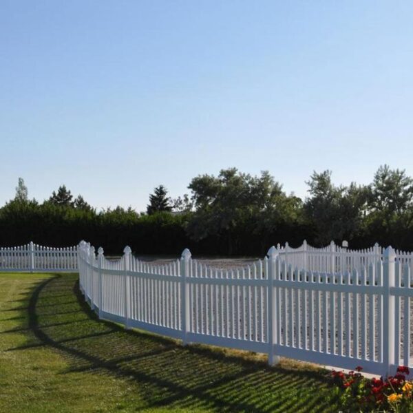 Grantham white vinyl picket fence along driveway