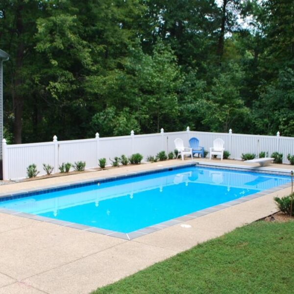 Reading white vinyl pool fence near pool