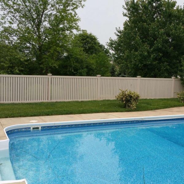 Reading khaki vinyl pool fence near pool