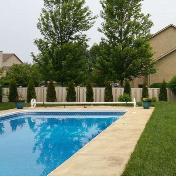 Reading khaki vinyl pool fence distance view