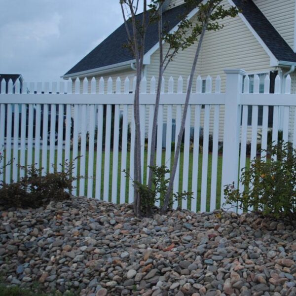 Durham white vinyl picket fence rock garden