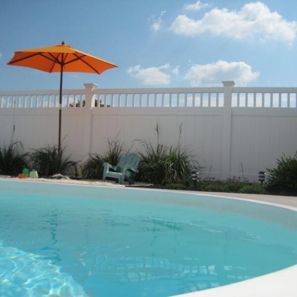 Portsmouth white vinyl privacy fence around a pool