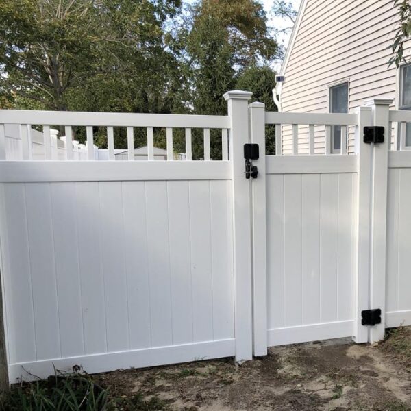 Portsmouth white vinyl privacy fence gate near house