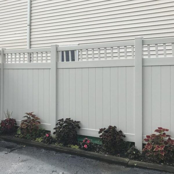 Portsmouth white vinyl privacy fence with plants