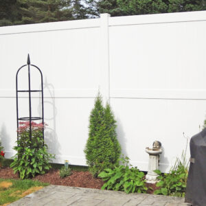 Newport white vinyl privacy fence and plants