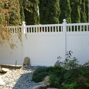 Portsmouth white vinyl privacy fence gate with gravel garden