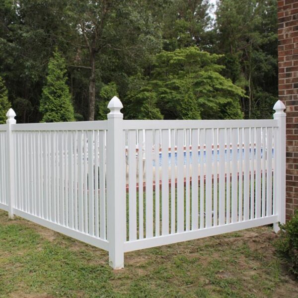 Austell white vinyl pool fence with post caps in front of pool