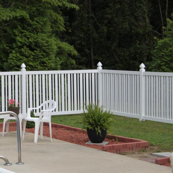 Austell white pool fence behind potted plant