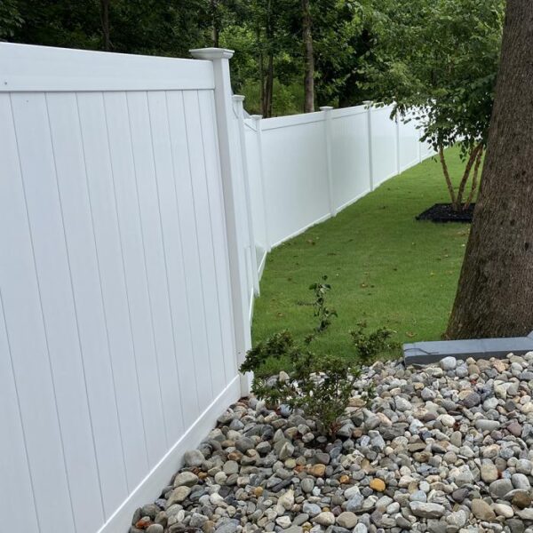 Ashforth white vinyl privacy fence gravel garden