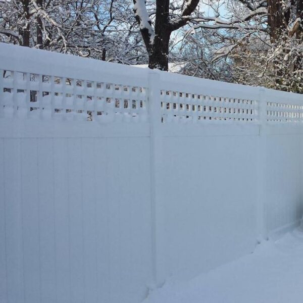 Briston white vinyl privacy fence in the snow