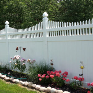 Turnbridge white vinyl privacy fence behind flower garden