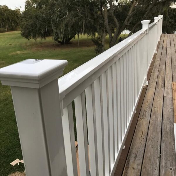 Harrington White vinyl railing near willow tree