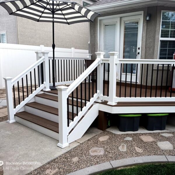 Kirklees White vinyl railing with black and white umbrella