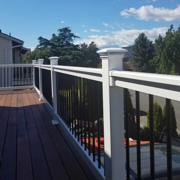 Kirklees White vinyl railing with hill backdrop