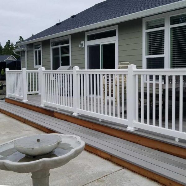 Brighton white vinyl railing with fountain in foreground