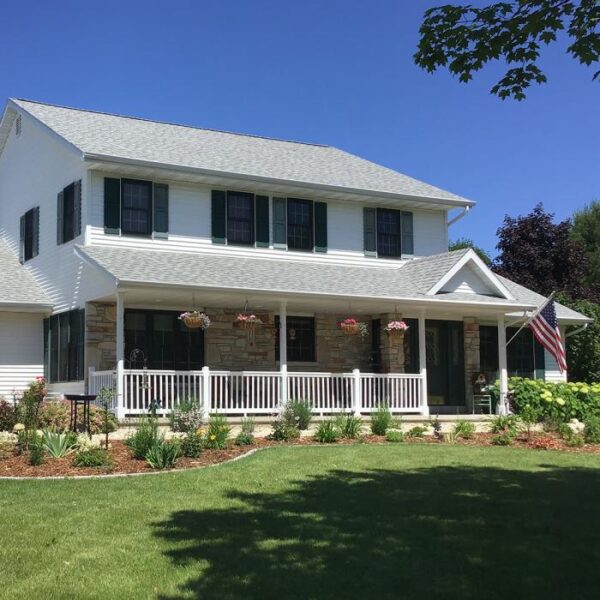 Brighton white vinyl railing behind large yard