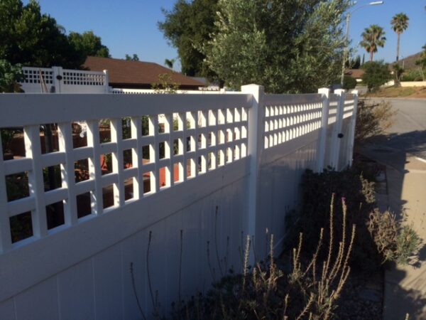 Cyrus white vinyl privacy fence along sidewalk